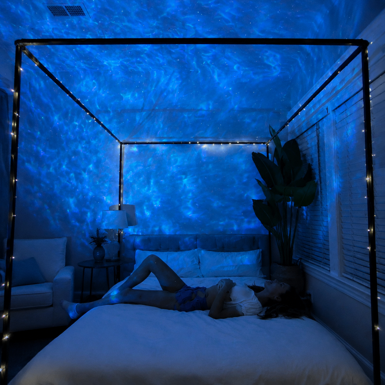 Galaxy star projector creating a multicolour star field in a living room