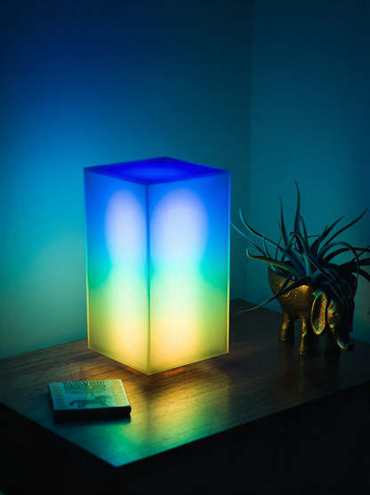 Lumen smart LED lamp glowing multicolour pattern in bedroom