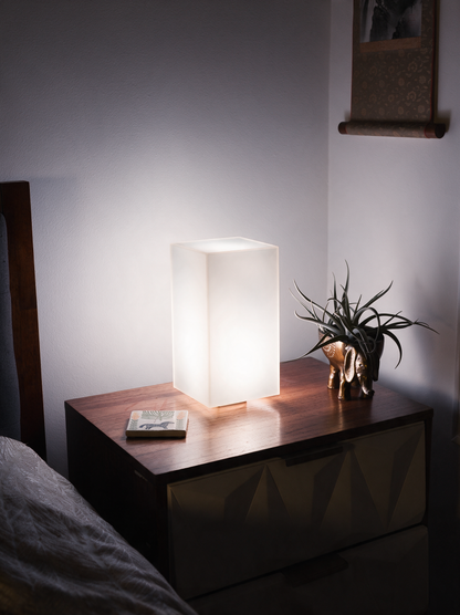 Lumen smart LED lamp glowing soft white pattern in bedroom