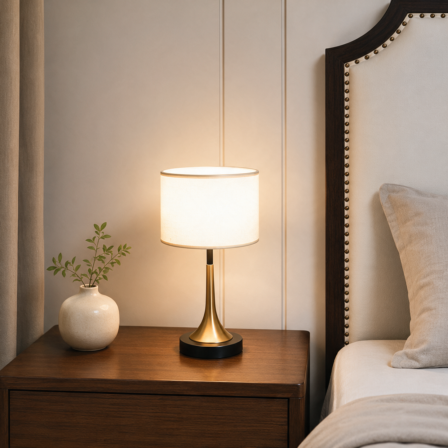 Amara touch-sensor table lamp glowing on nightstand